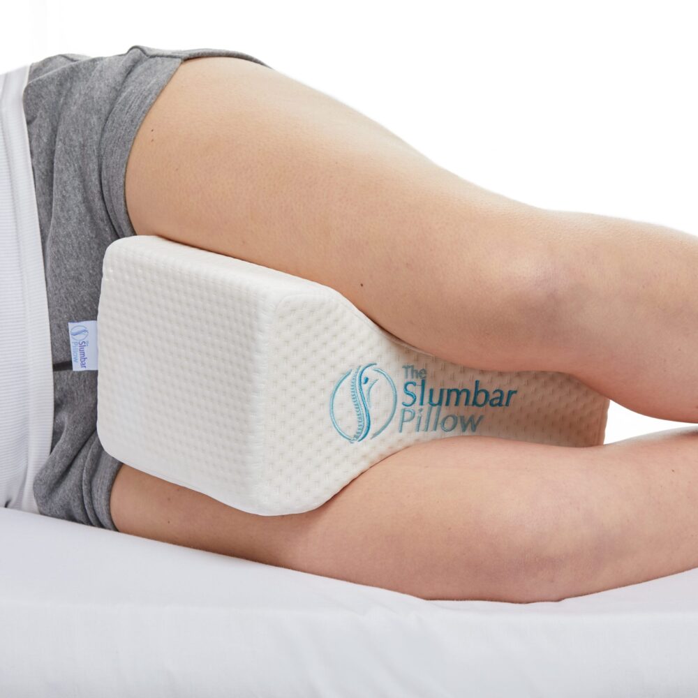 Knee pillow being used by a side sleeper